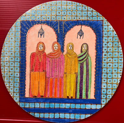Four women standing in front of their door in Chefchaouen, Morocco.